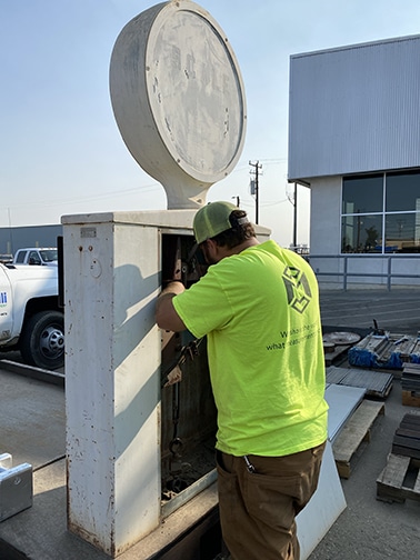A Michelli Weighing & Measurement service technician repairs a scale