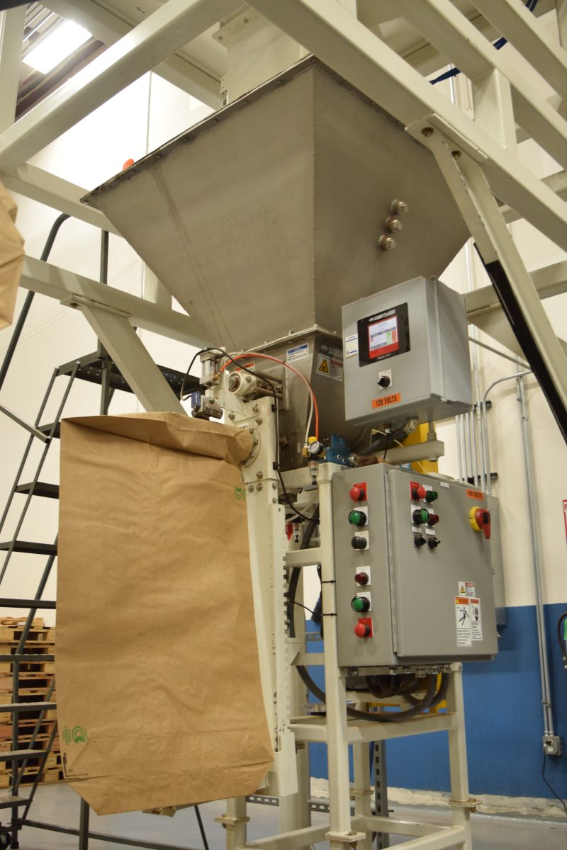 Quality control weighing system including a hopper, indicator, valve system and a scale