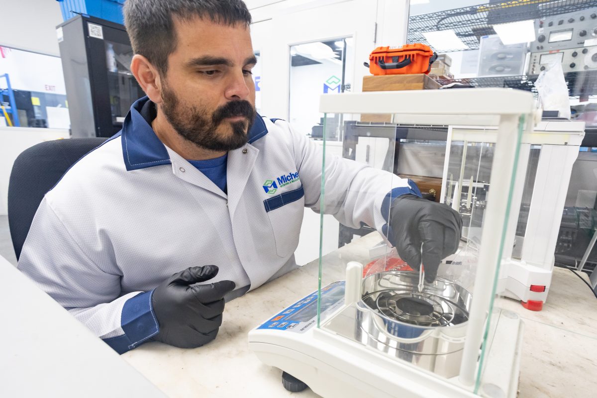 A Michelli technician calibrates lab equipment